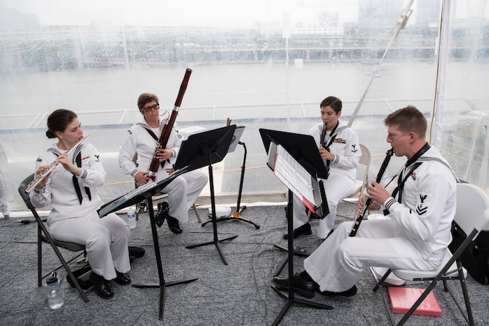 Navy Band Northwest performs on Independence-variant littoral combat ship, USS Kansas City (LCS 22) for a U.S. Navy reception during Portland Fleet Week in Portland, Oregon, June 9, 2023.  Portland Fleet Week is a time-honored celebration of the sea services and provides an opportunity for the citizens of Oregon to meet Sailors, Marines and Coast Guardsmen, as well as witness firsthand the latest capabilities of today’s maritime services. (U.S. Navy photo by Mass Communication Specialist Seaman Sophia H. Bumps)