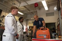 Jason Williams from Portland Fire Department Station 3 gives a tour to Hospital Corpsman Second Class Kevin German and Hospital Corpsman Third Class Kinyua Anastasia assigned to the Arleigh Burke-class guided-missile destroyer, USS John S. McCain (DDG 56), in Portland, Oregon for the annual Rose Festival during Portland Fleet Week on June 10, 2023. Portland Fleet Week is a time-honored celebration of the sea services and provides an opportunity for the citizens of Oregon to meet Sailors, Marines and Coast Guardsmen, as well as witness firsthand the latest capabilities of today’s maritime services.