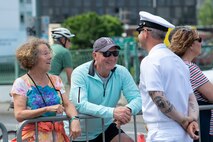 Sailors assigned to the Arleigh Burke-class guided-missile destroyer, USS John S. McCain (DDG 56), interact with the crowd at the annual Rose Festival Parade during Portland Fleet Week in Portland, Oregon, June 10, 2023. Portland Fleet Week is a time-honored celebration of the sea services and provides an opportunity for the citizens of Oregon to meet Sailors, Marines and Coast Guardsmen, as well as witness firsthand the latest capabilities of today's maritime services. (U.S. Navy photo by Mass Communication Specialist Seaman Sophia H. Bumps)