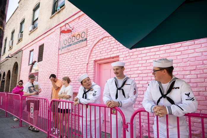 Hospital Corpsman 1st Class Stephanie Fanchiang, Electrician’s Mate Fireman Matthew Zimmer and Sonar Technician 2nd Class Greylan Smith, all assigned to USS Kansas City (LCS 22), wait in line for VooDoo Donuts during Portland Fleet Week in Portland, Oregon, June 11, 2023. Portland Fleet Week is a time-honored celebration of the sea services and provides an opportunity for the citizens of Oregon to meet Sailors, Marines and Coast Guardsmen, as well as witness firsthand the latest capabilities of today's maritime services. (U.S. Navy photo by Mass Communication Specialist Seaman Sophia H. Bumps)