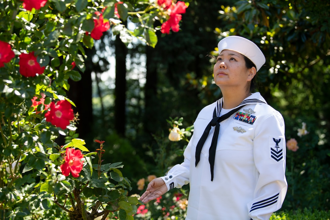 Hospital Corpsman 1st Class Stephanie Fanchiang, assigned to USS Kansas City (LCS 22), visits the rose garden during Portland Fleet Week in Portland, Oregon, June 11, 2023. Portland Fleet Week is a time-honored celebration of the sea services and provides an opportunity for the citizens of Oregon to meet Sailors, Marines and Coast Guardsmen, as well as witness firsthand the latest capabilities of today's maritime services. (U.S. Navy photo by Mass Communication Specialist Seaman Sophia H. Bumps)
