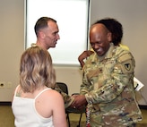 Col. Clayton Carr, right, shakes hands with Maj. Matthew Smith following U.S. Army Medical Logistics Command’s Headquarters and Headquarters Detachment change of command ceremony June 9 at Fort Detrick, Maryland. During the ceremony, Smith passed detachment command to Capt. Matthew Lile. (U.S. Army photo by C.J. Lovelace)