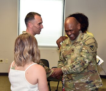 Col. Clayton Carr, right, shakes hands with Maj. Matthew Smith following U.S. Army Medical Logistics Command’s Headquarters and Headquarters Detachment change of command ceremony June 9 at Fort Detrick, Maryland. During the ceremony, Smith passed detachment command to Capt. Matthew Lile. (U.S. Army photo by C.J. Lovelace)