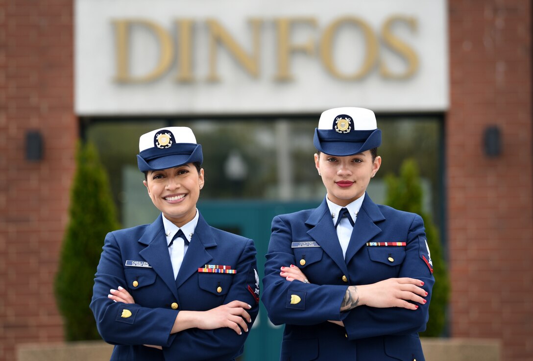 U.S. Coast Guard Petty Officer 3rd Class Diolanda Caballero and Petty Officer 3rd Class Breanna Centeno, stand out front of the Defense Information School, following their advancement ceremony on Fort George G. Meade, Maryland, April 16, 2021. Caballero and Centeno were advanced to public affairs specialist third class upon graduating the 108-day Mass Communication Foundations course. (U.S. Coast Guard photo by Petty Officer 1st Class Jon-Paul Rios.)