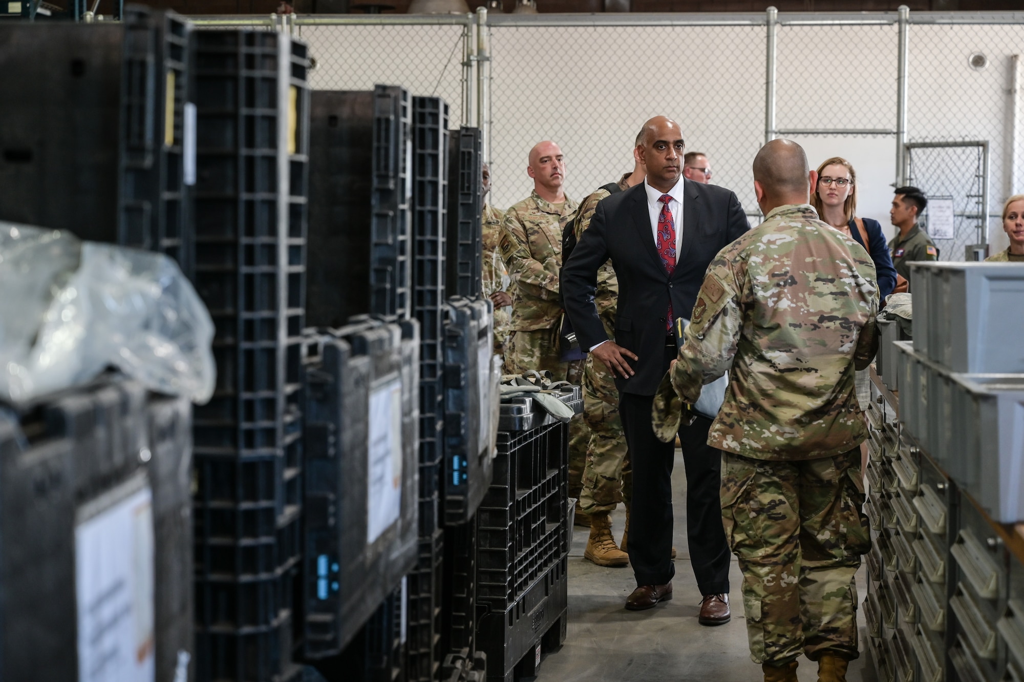 The Honorable Ravi Chaudhary, Assistant Secretary of the Air Force for Energy, Installations, and Environment, visits the 647th Logistics Readiness Squadron Mobility Processing Center during a tour of the 15th Wing on Joint Base Pearl Harbor-Hickam, Hawaii, Jun. 6, 2023. During the visit, Chaudhary was familiarized with 647th Air Base Group operations and their role in delivering mission support for base, theater and global air and joint operations. (U.S. Air Force photo by Staff Sgt. Alan Ricker)
