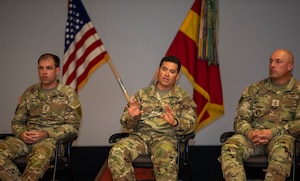 U.S. Army 1st Sgt. Moses Garcia, a field artillery senior sergeant assigned to Headquarters and Headquarters Battalion, 1st Infantry Division Artillery, 1st Inf. Div. (center), speaks about pathways Soldiers can take towards pursuing higher education during a panel discussion at Barlow Theater on Fort Riley, Kansas, May 24, 2023. Garcia spoke about how pursuing higher education can make a Soldier stand out amongst their peers. (U.S. Army photo by Spc. Joshua Holladay)