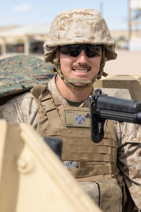 U.S. Marine Corps Cpl. Evan Doig, a gunner assigned to Maintenance Service Co., Combat Logistics Battalion 25, Combat Logistics Regiment 45, 4th Marine Logistics Group, Marine Forces Reserve, prepares to load poses for a photo at Range 113, Marine Corps Air-Ground Combat Center, Twentynine Palms, California, as part of Integrated Training Exercise 4-23, June 11, 2023. As the Marine Corps Reserve’s premier annual training event, ITX provides opportunities to mobilize geographically dispersed forces for a deployment; increase combat readiness and lethality; and exercise MAGTF command and control of battalions and squadrons across the full spectrum of warfare. Doig is a native of Boston, Massachusetts and attended Nashoba High School. (U.S. Marine Corps Photo by Lance Cpl. Juan Diaz)