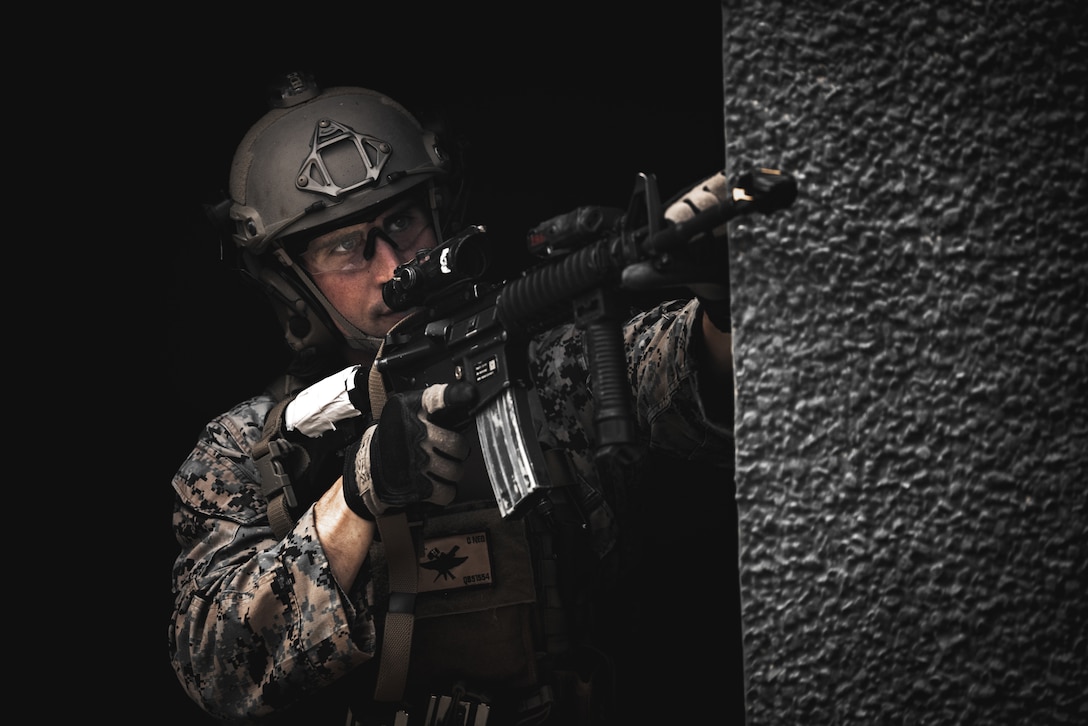 U.S Marine Corps Capt. Quinton Boyed, field artillery officer, 2d Air Naval Gunfire Liaison Company, II Marine Expeditionary Force Information Group, provides security while at the Outdoor Infantry Immersion Trainer on Marine Corps Base Camp Lejeune, North Carolina, May 18, 2023. U.S. Marines worked alongside partners and allies from ​Norway, France, Finland, and Sweden. The OIIT provided Marines and international partners with scenario based realistic training, creating a fully immersive environment using role players, pyrotechnics, subject matter experts, and sound and smell generators.