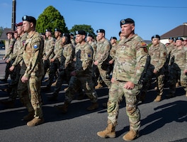 1st Infantry Division Soldiers march alongside Soldiers from the 29th Infantry Division, 36th Engineer Brigade and 90th Sustainment Brigade, in Picauville, France, June 2, 2023. U.S. Army Europe and Africa commemorated the 79th anniversary of D-Day, the largest multinational amphibious landing and operational military airdrop in history, and highlights the U.S.' steadfast commitment to European allies and partners. Hand-selected Big Red One noncommissioned officers represented the Division throughout D-Day commemorations as part of the Big Red One Year of the NCO campaign. The campaign further develops our NCO Corps and recognizes their contributions, both personal and professional, to the 1st Infantry Division. (U.S. Army photo by Pfc. Daniela Lechuga)