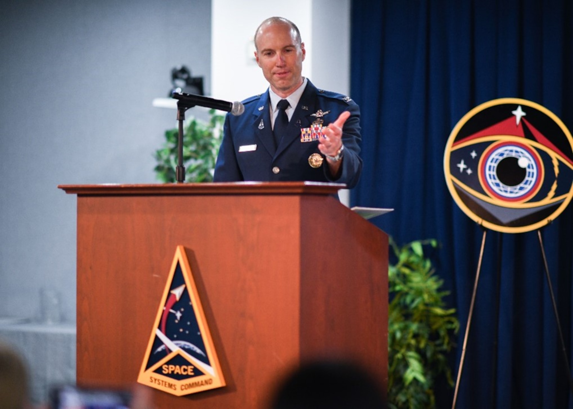 Col. Robert Davis, new program executive officer of Space Systems Command’s Space Sensing program executive office, shared remarks during a change of leadership ceremony at SSC headquarters, Los Angeles Air Force Base, California, June 8, 2023.  Davis, who joins as the new PEO with more than 20 years of military service, amplified the importance of the workforce’s need to remain vigilant with its ability to prevail in its given mission because, as he exclaimed, “make no mistake…we are absolutely in a race.”  (U.S. Space Force photo by Van De Ha)
