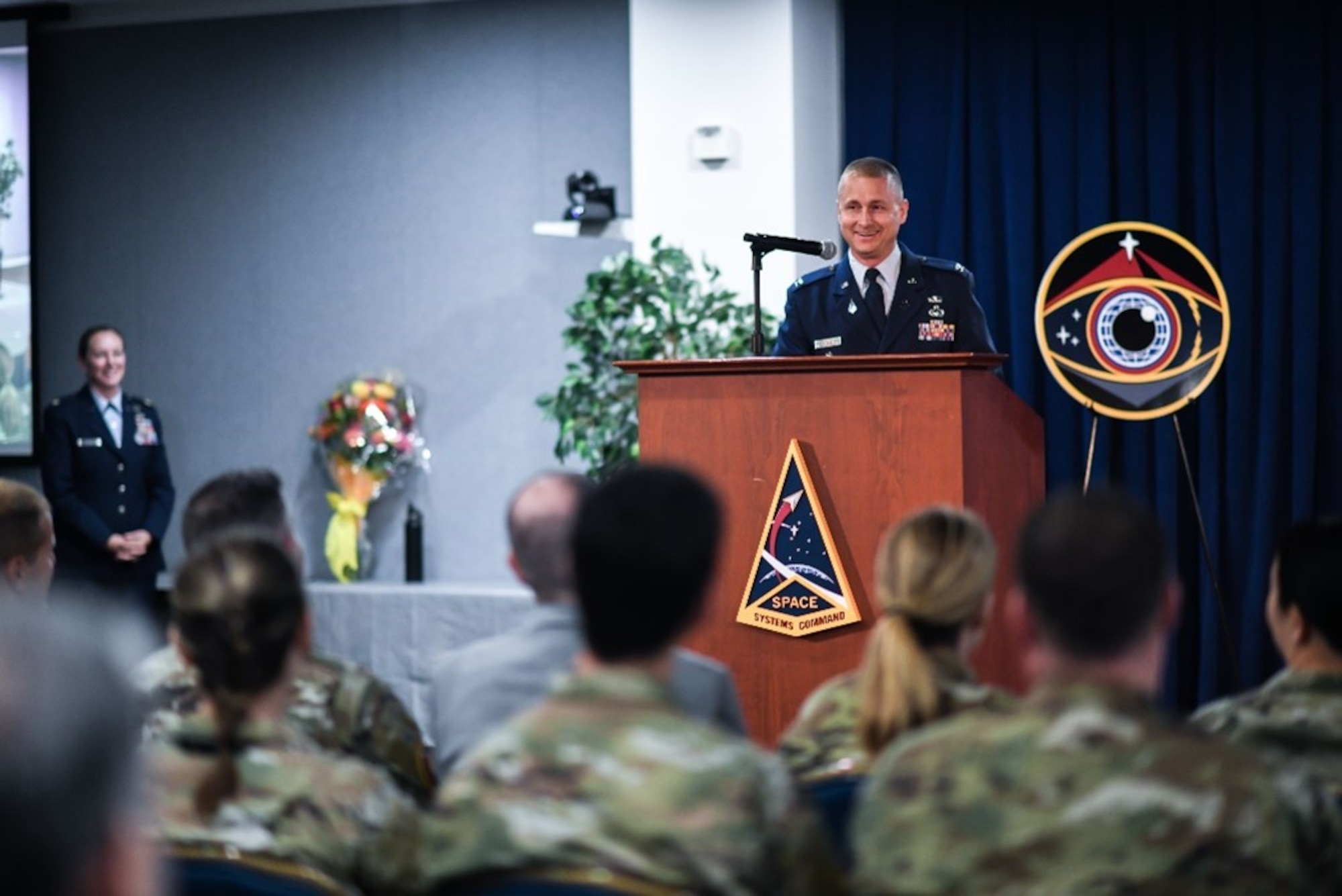 Col. Brian Denaro, outgoing program executive officer of Space Sensing, delivers his final remarks during a change of leadership ceremony at Space System Command headquarters, Los Angeles Air Force Base, California, June 8, 2023. Under Denaro’s tenure, Space Sensing completed SSC’s Space Based Infrared System (SBIRS) constellation with GEO-6, providing persistent missile warning and launch detection crucial to national defense and deterrence.  (U.S. Space Force photo by Van De Ha)