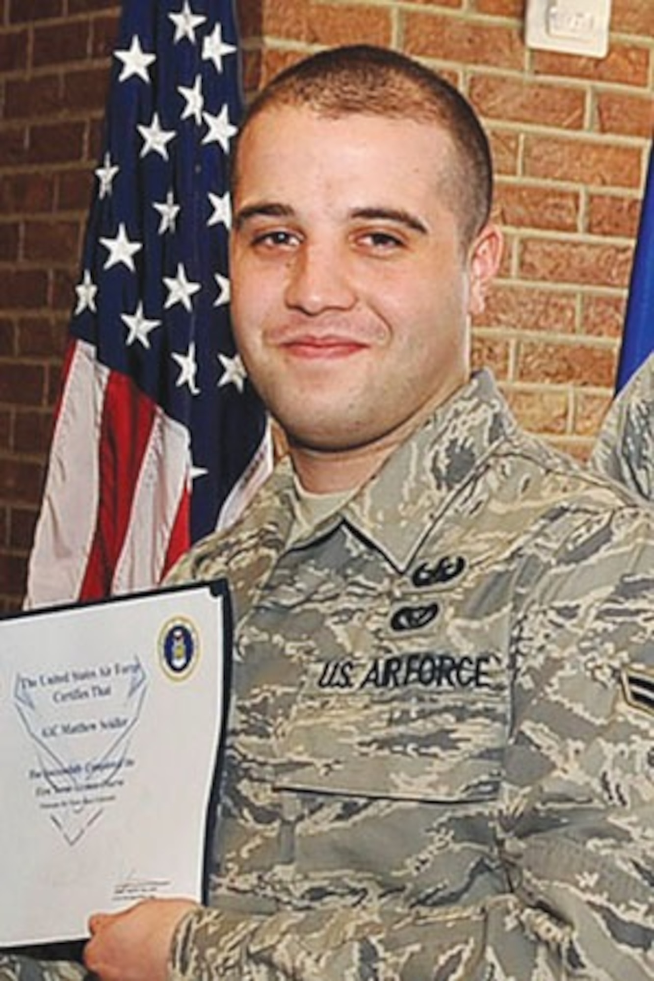 U.S. Air Force Airman 1st Class Matthew Seidler, an Explosive Ordnance Device technician from the 21st Civil Engineer Squadron, receives an official Air Force certificate. Seidler was killed at age 24 when an improvised explosive device hit his vehicle in Afghanistan on Jan. 5, 2012. (Courtesy photo)