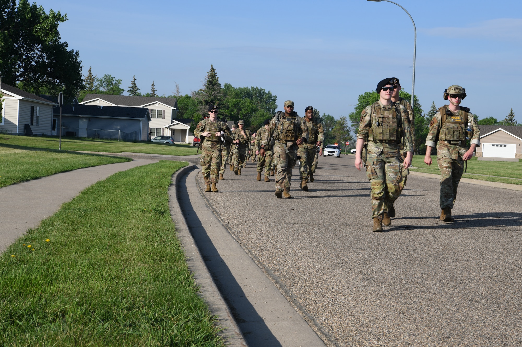 U.S. Air Force Security Forces Airmen from the 5th Security Forces Squadron and the 91st Security Forces Group participate in a ruck march June 5, 2023 at Minot Air Force Base, North Dakota. The Security Forces Airmen marched to kick off 2023 National Police Week. (U.S. Air Force photo by Airman 1st Class Trust Tate)