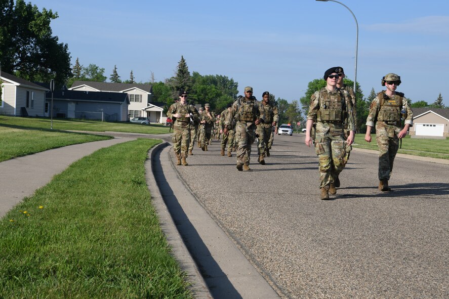 U.S. Air Force Security Forces Airmen from the 5th Security Forces Squadron and the 91st Security Forces Group participate in a ruck march June 5, 2023 at Minot Air Force Base, North Dakota. The Security Forces Airmen marched to kick off 2023 National Police Week. (U.S. Air Force photo by Airman 1st Class Trust Tate)