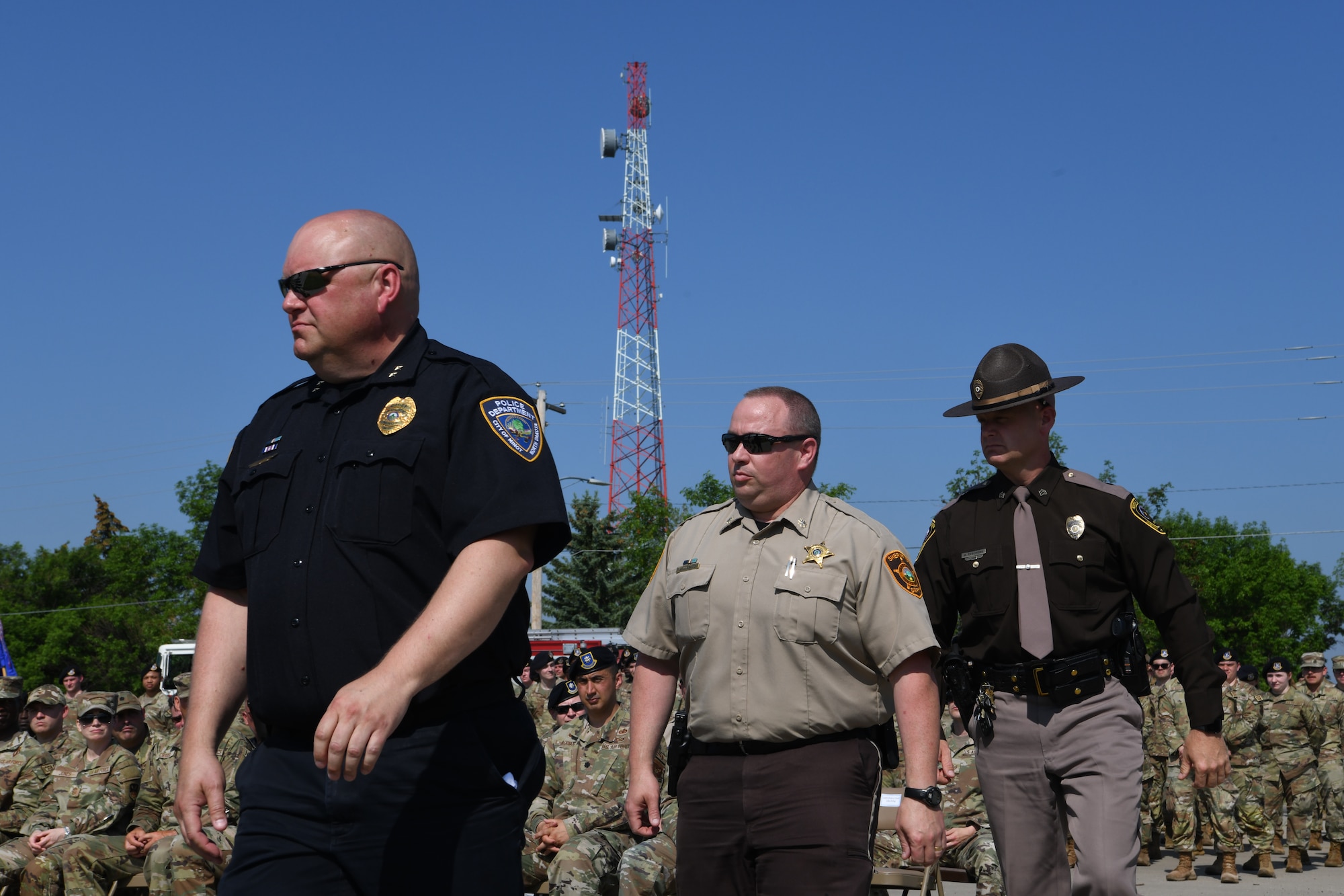 Minot Police Department prepares to give a speech for National Police Week June 5, 2023 at Minot Air Force Base, North Dakota. Speakers at the opening ceremony included members from the 5th Security  Forces Squadron, 91st Security Forces Group, City of Minot Police Department, and Col. Daniel S. Hoadley, commander of the 5th Bomb Wing.  (U.S. Air Force photo by Airman 1st Class Trust Tate)