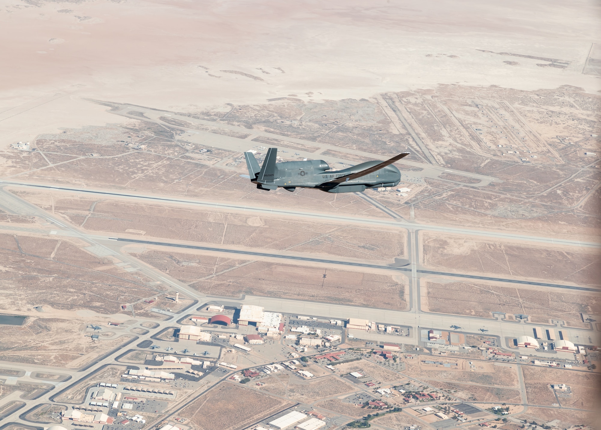 An RQ-4 Global Hawk assigned to the 452nd Flight Test Squadron flies in the skies above Edwards Air Force Base, California, May 23. The 452nd FLTS recently completed its test campaign on the Global Hawk. (Air Force photo by Bryce Bennett)