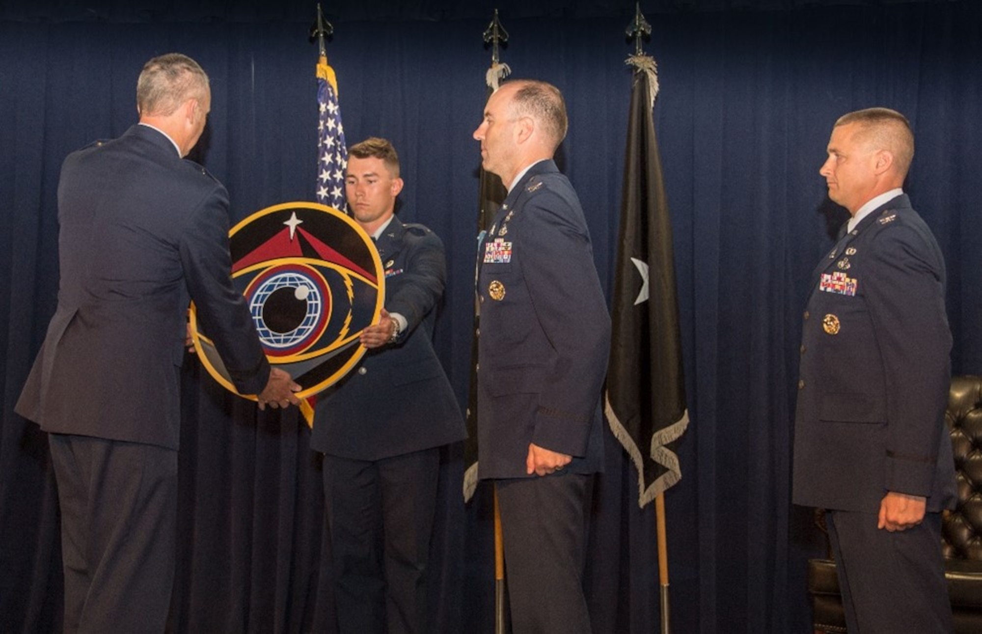 Brig. Gen. Jason Cothern, Space Systems Command, deputy commander, officiates a change of leadership ceremony, where outgoing program executive officer, Col. Brian Denaro relinquishes leadership of SSC’s Space Sensing Program Executive Office to Col. Robert Davis, at SSC headquarters, Los Angeles Air Force Base, California, June 8, 2023. Space Sensing is one of five SSC program executive offices and is responsible for delivering space-based missile warning, tracking, and defense capabilities; space-based environmental monitoring (SBEM) capabilities; and other tactical intelligence, surveillance, and reconnaissance capabilities, ensuring end-to-end mission integration. (U.S. Space Force photo by Van De Ha)