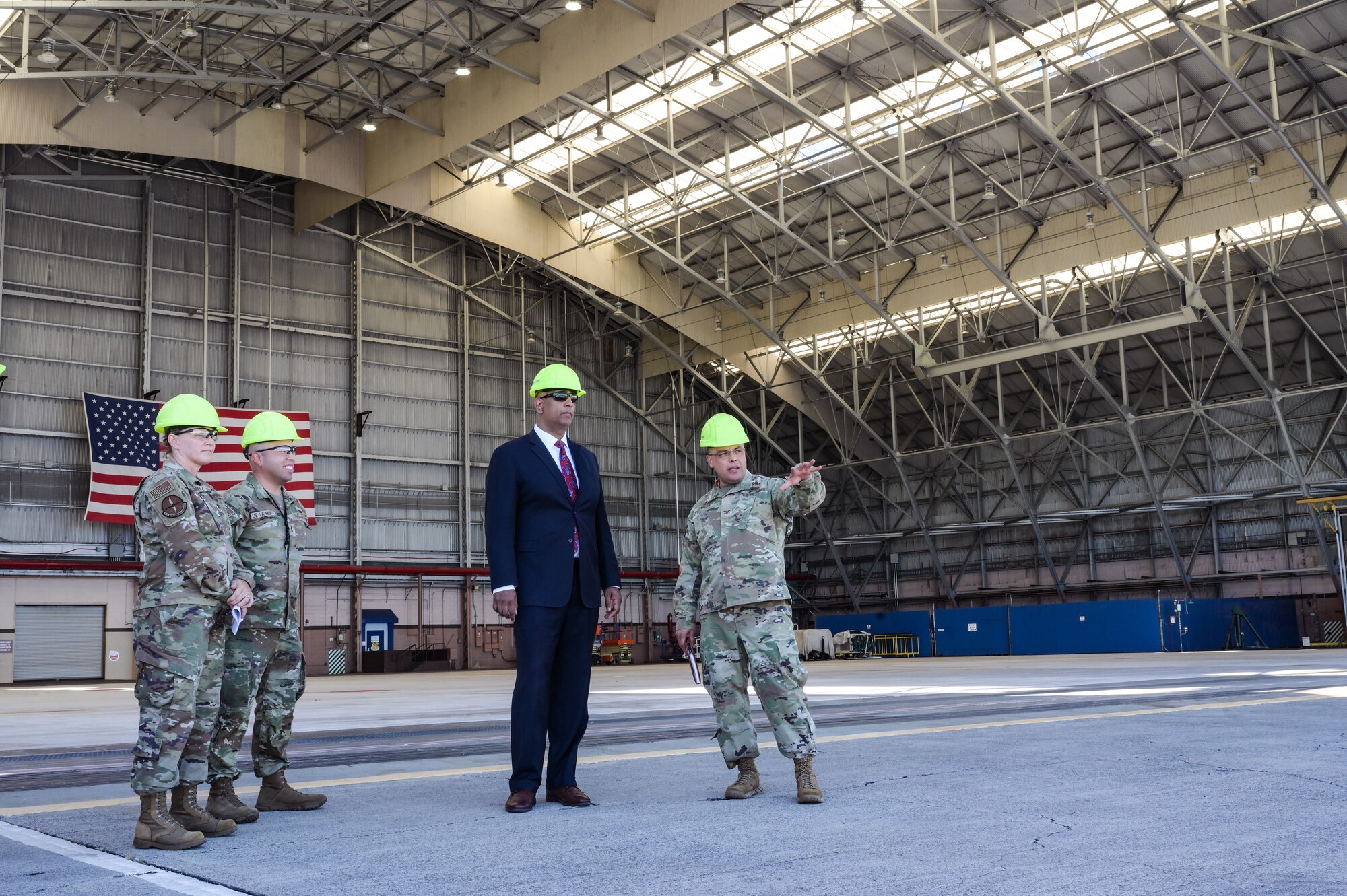 Col. Andrew Garcia, 15th Maintenance Group commander, speaks to Honorable Ravi Chaudhary, Assistant Secretary of the Air Force for Energy, Installations, and Environment, about current hangar and equipment conditions during a tour of the 15th Wing on Joint Base Pearl Harbor-Hickam, Hawaii, Jun. 6, 2023. Chaudhary met with several Air Force leaders learning the unique missions of the 15th Wing and the 647th Air Base Group. (U.S. Air Force photo by Staff Sgt. Alan Ricker)