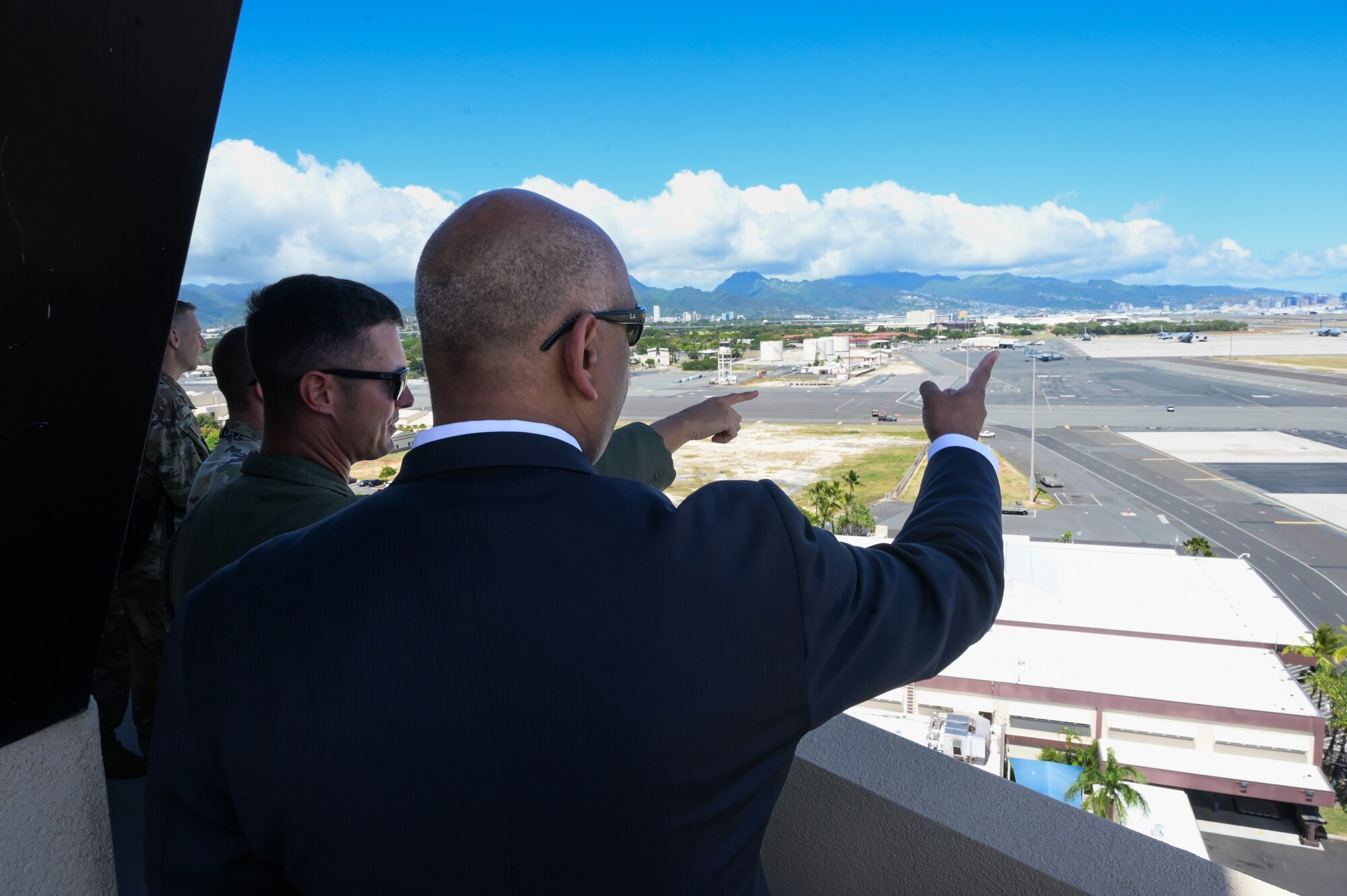 Lt. Col. Scott Durham, 15th Operations Support Squadron commander, briefs Honorable Ravi Chaudhary, Assistant Secretary of the Air Force for Energy, Installations, and Environment, on flightline challenges and operations during a tour of the 15th Wing on Joint Base Pearl Harbor-Hickam, Hawaii, Jun. 6, 2023. Chaudhary learned of the challenges the 15th Wing faces with providing a sustainable flightline to assist entities that require strategic airlift support. (U.S. Air Force photo by Staff Sgt. Alan Ricker)