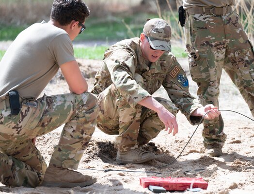  PETERSON SPACE FORCE BASE, Colo. – U.S. Air Force Tech. Sgt. David Corley, 21st Civil Engineer Squadron Explosive Ordnance Disposal team lead, trains Airman 1st Class Griffin Walraven, an EOD apprentice, and other technicians, on improvised explosive device mitigation techniques on Peterson Space Force Base, Colorado, May 25, 2023. The technicians must undergo continuous recertification to sustain peak mental and physical performance. (U.S. Space Force photo by Airman 1st Class Justin Todd)