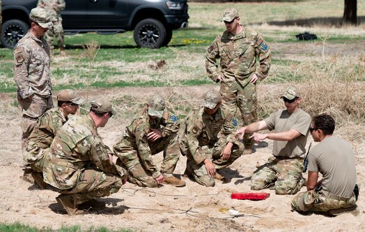  PETERSON SPACE FORCE BASE, Colo. – U.S. Air Force Tech. Sgt. Chris Camille, second from right, an Explosive Ordnance Disposal team lead from the 21st Civil Engineering Squadron, trains EOD Airmen on improvised explosive device mitigation techniques on Peterson Space Force Base, Colorado, May 25, 2023. During this training, each Airman received hands-on experience with various materials EOD service members use to accomplish their mission. (U.S. Space Force photo by Airman 1st Class Justin Todd)