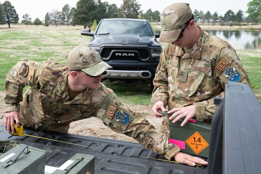  PETERSON SPACE FORCE BASE, Colo. – U.S. Air Force Senior Airmen Reese Collins, and Explosive Ordnance Disposal apprentice, and Jacob Rice, an EOD team member, both part of the 21st CES EOD, measure detonating cords as part of a training on Peterson Space Force Base, Colorado, May 25, 2023. Collins and Rice cut multiple cords and measured each one to ensure they were the same length to detonate simultaneously. (U.S. Space Force photo by Airman 1st Class Justin Todd)