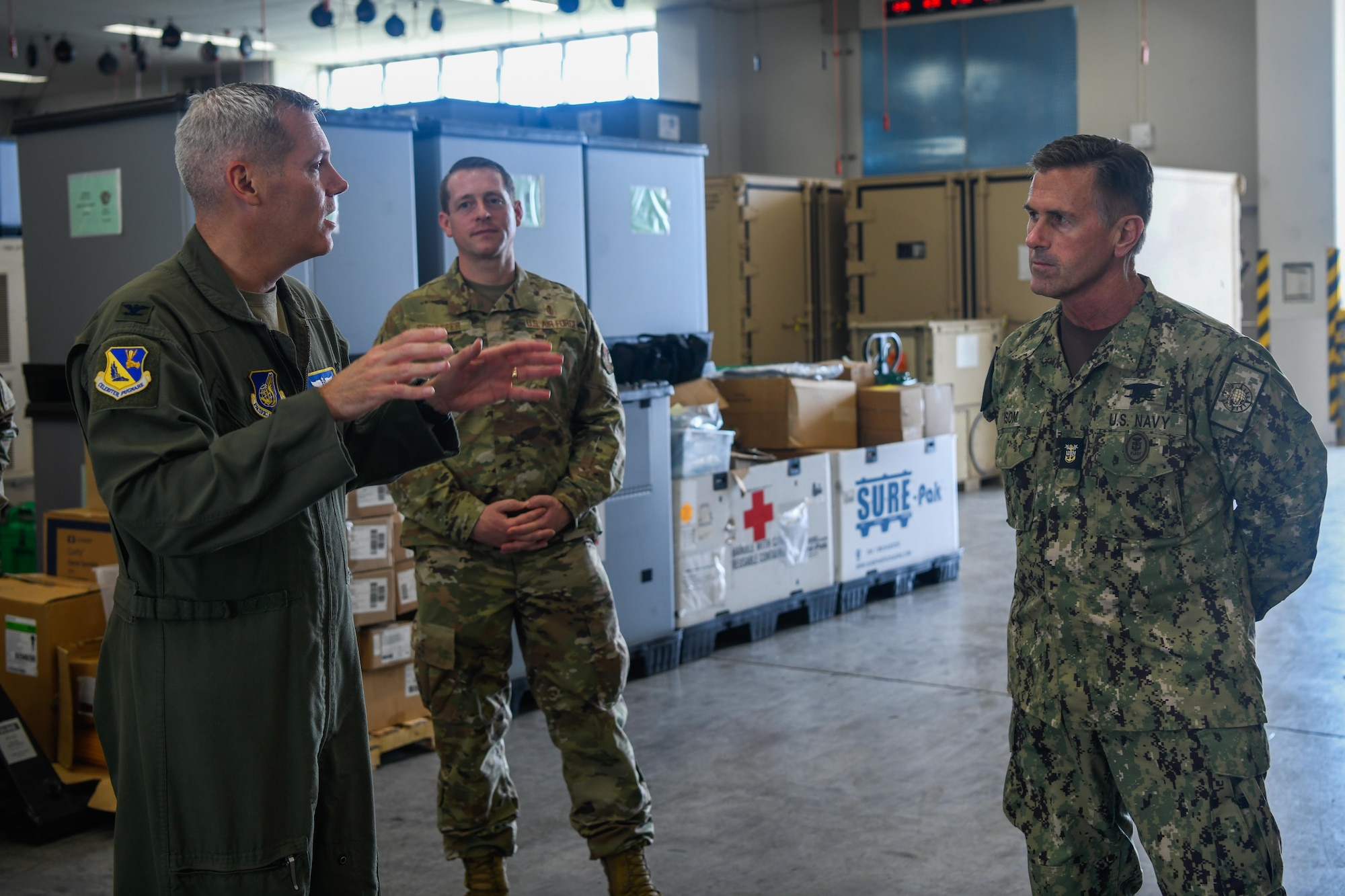 Service members speak to each other.