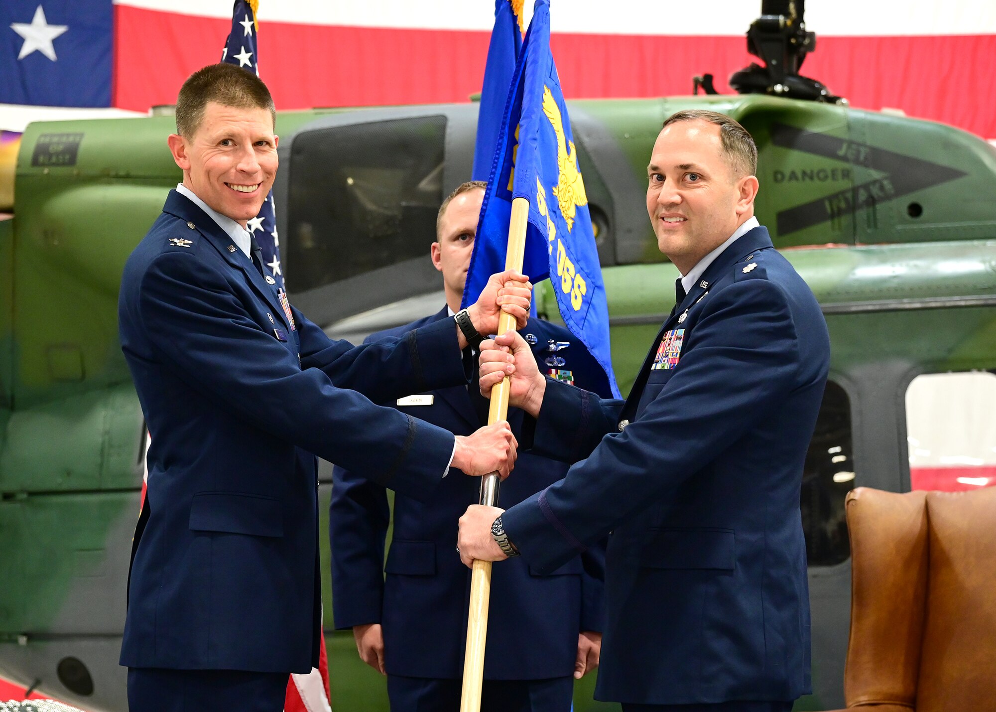 military personnel passing the guidon