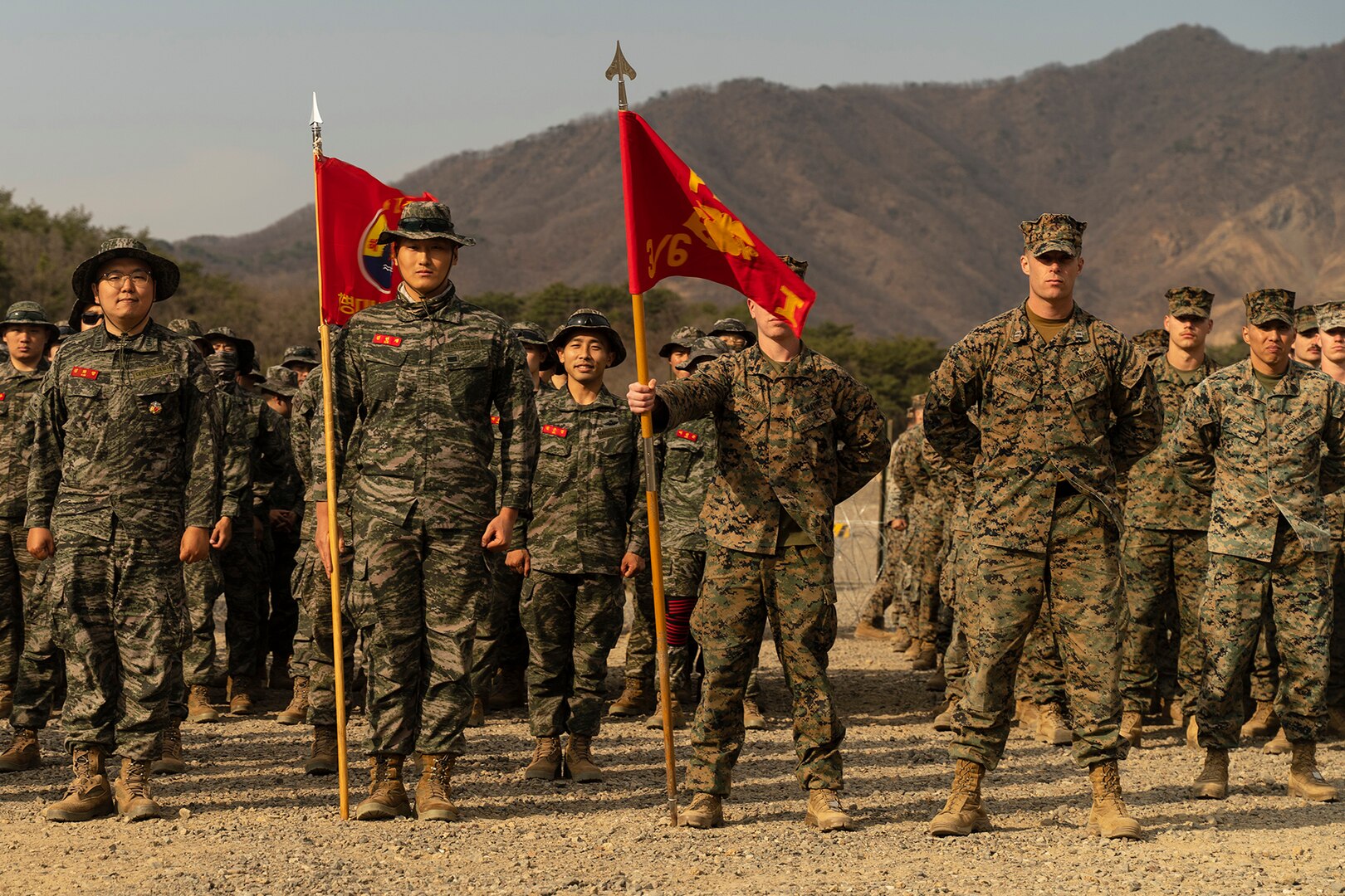 Men in uniform pose for a group photograph.