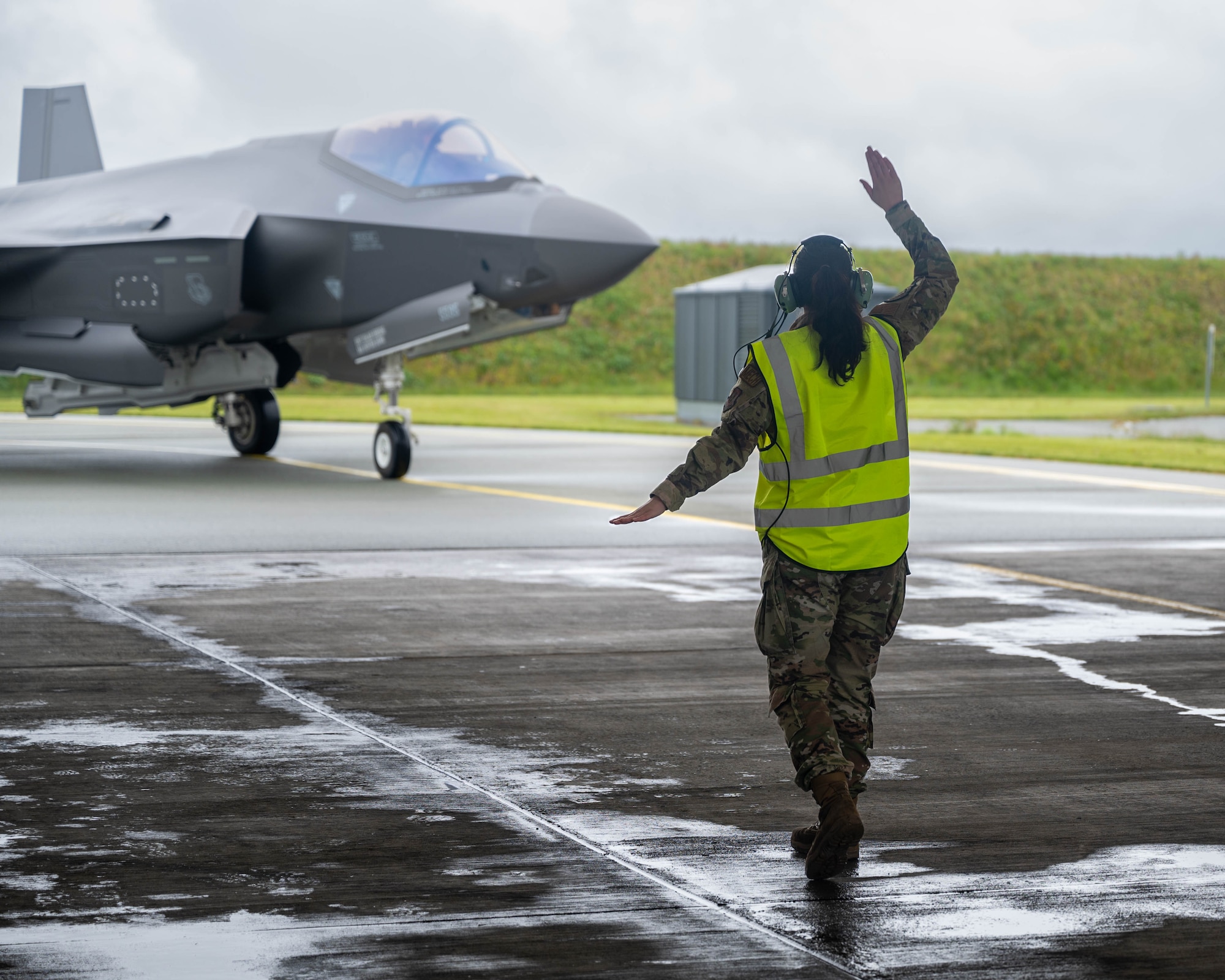 Crew Chief marshals an F-35.