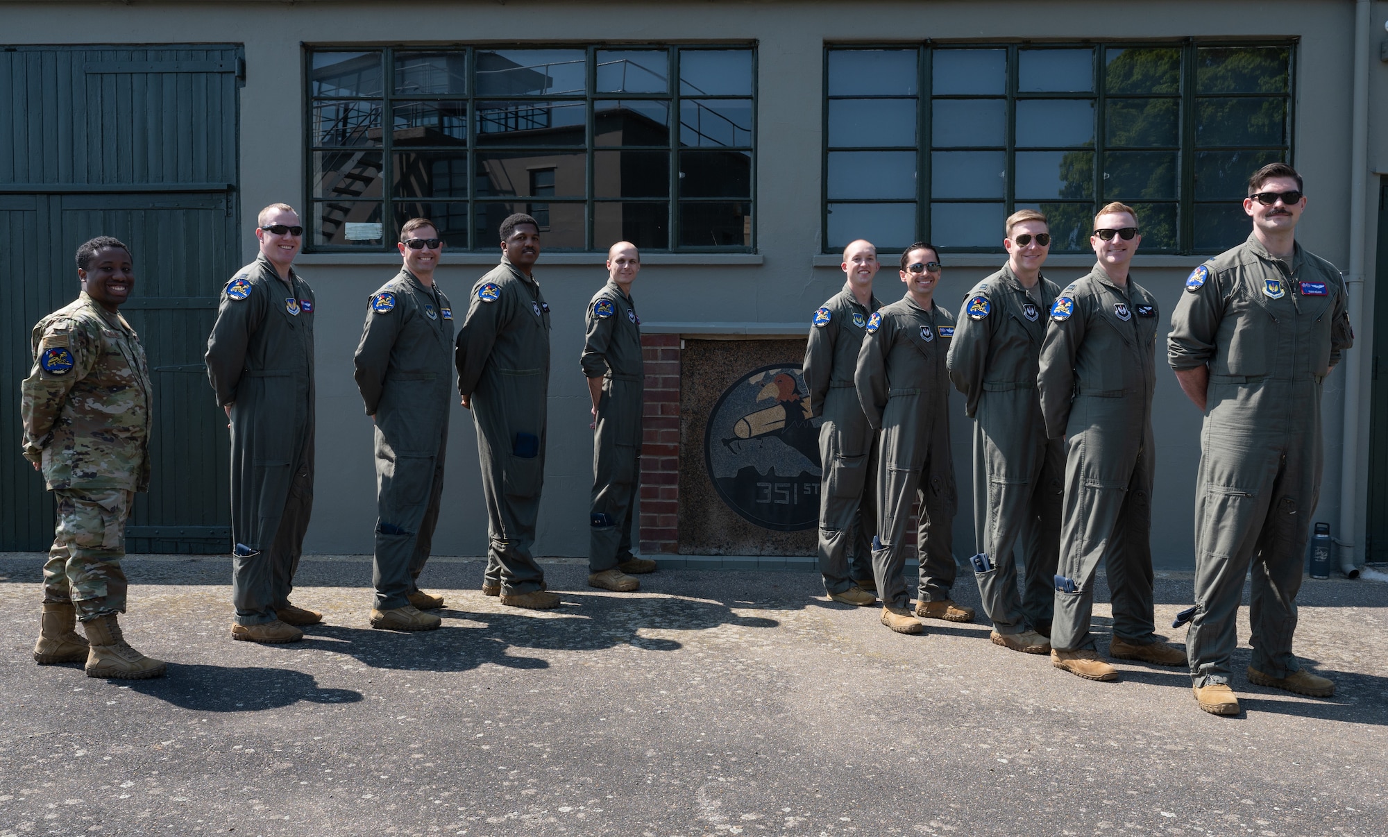 U.S. Air Force Airmen assigned to the 351st Air Refueling Squadron stand together at the 100th Bomb Group Memorial Museum after a patching ceremony, Thorpe Abbotts, England, June 9, 2023.