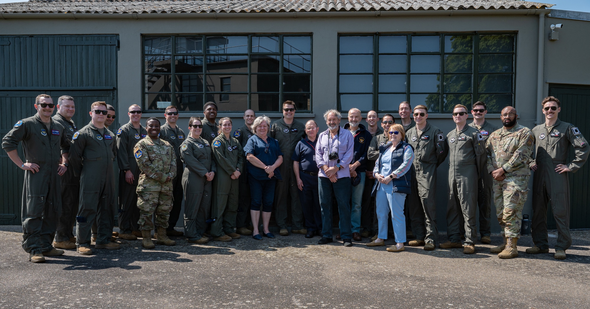 U.S. Air Force Airmen assigned to the 351st Air Refueling Squadron and volunteers from the 100th Bomb Group Memorial Museum gather after a patching ceremony, Thorpe Abbotts, England, June 9, 2023.