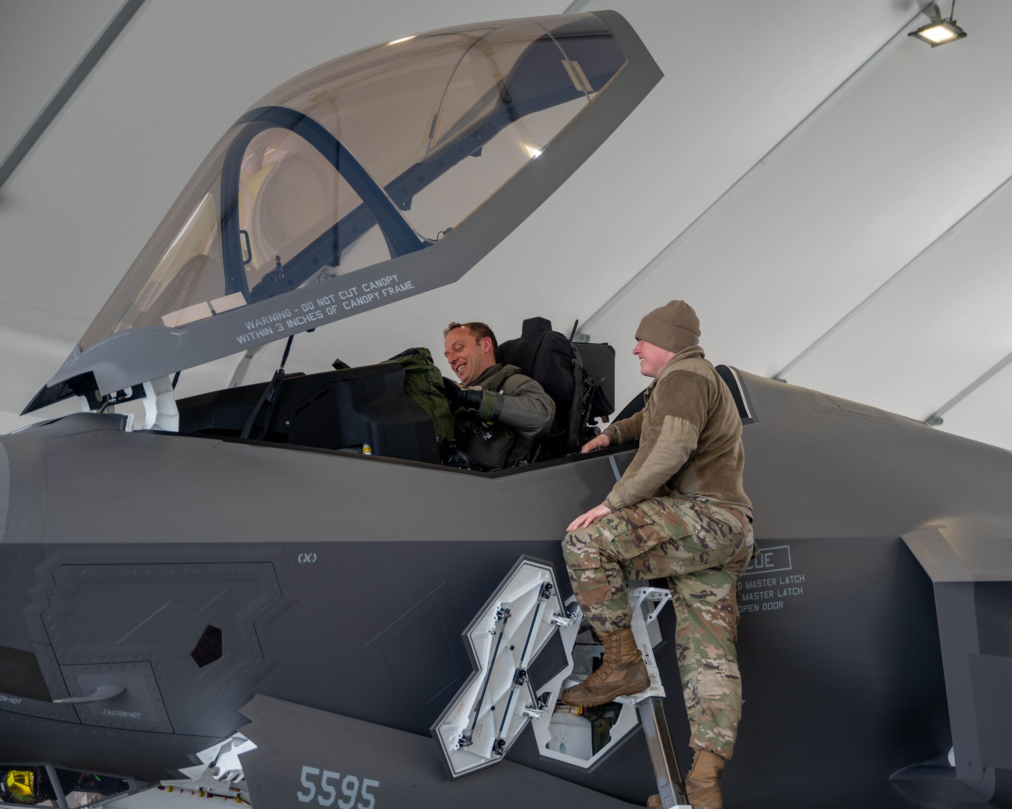 Crew Chief talks to pilot after an F-35 flight.