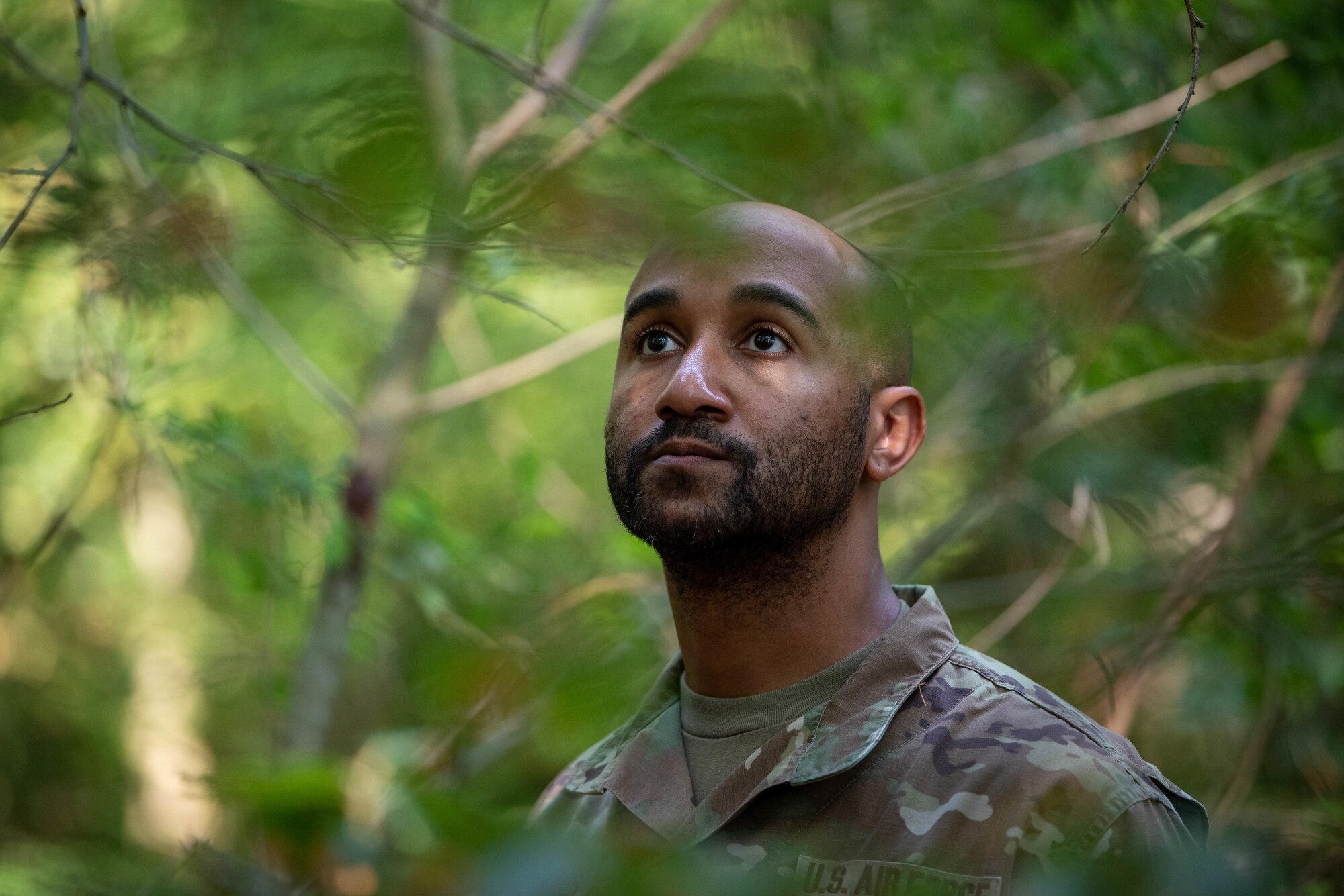 U.S. Air Force Master Sgt. Shaun Haynes, 52nd Force Support Squadron readiness and plans section chief, examines the area for artifacts such as personal valuables or simulated human remains during a search and recovery exercise on Ramstein Air Base, Germany.