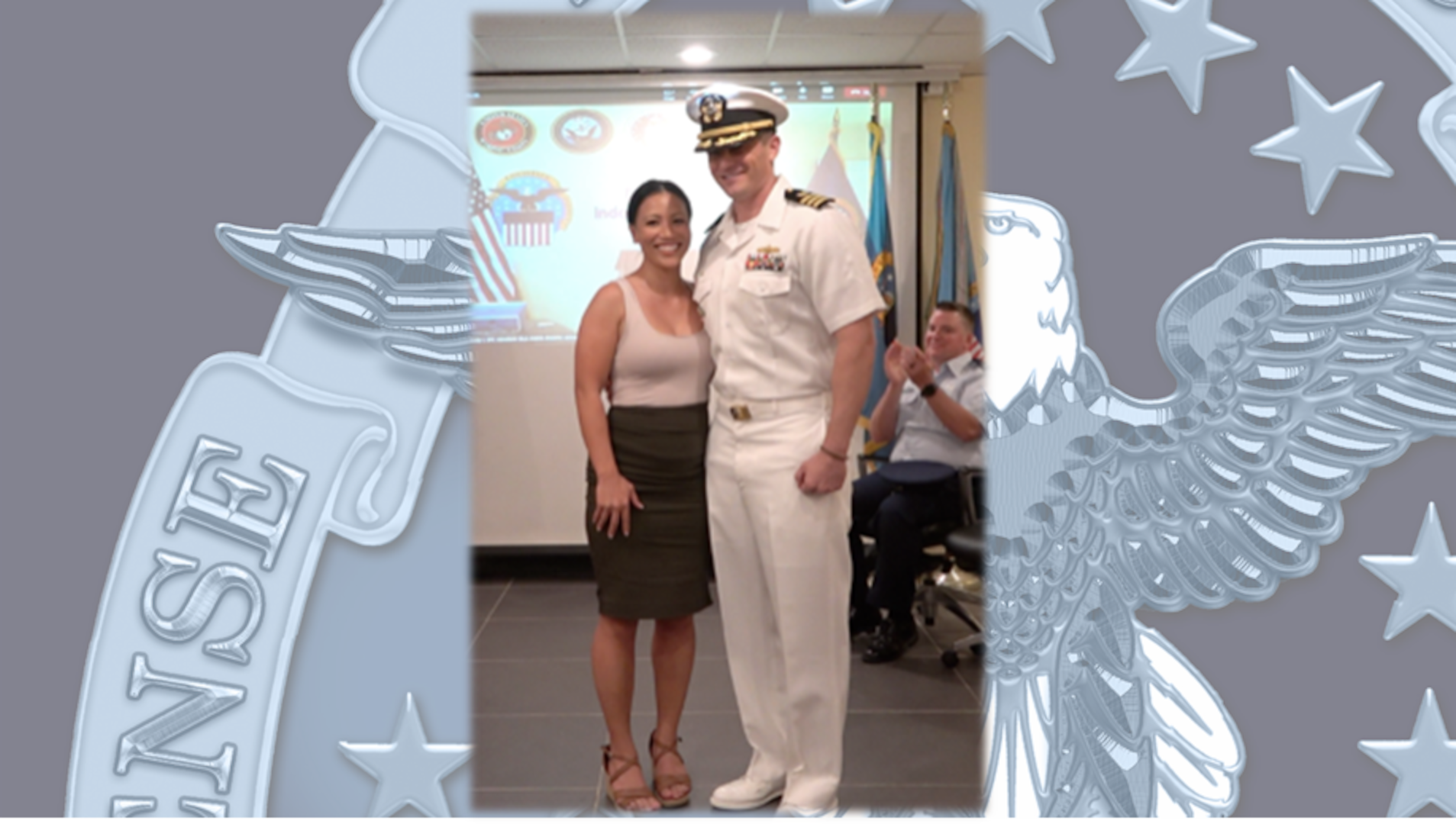 a Navy officer in unform with his wife