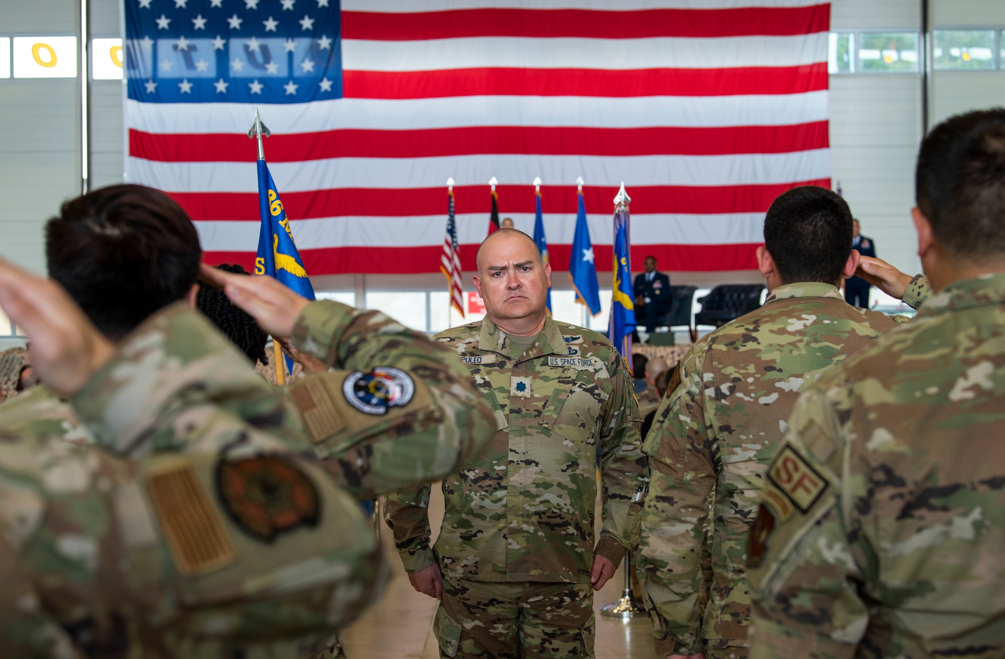 U.S. Space Force Lt. Col. Anthony Puleo, 86th Mission Support Group deputy commander calls a formation to present arms during a change of command ceremony at Ramstein Air Base, Germany, June, 9, 2023.