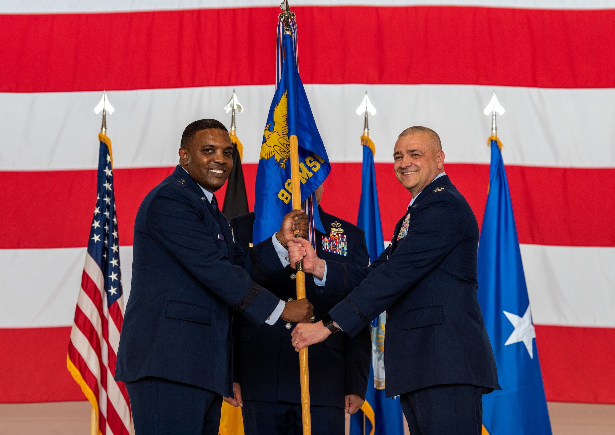 U.S. Air Force Brig. Gen. Otis C. Jones, 86th Airlift Wing commander, presents the guidon to Col. Amy M. Glisson, outgoing 86th Mission Support Group commander, at Ramstein Air Base, Germany, June 9, 2023.