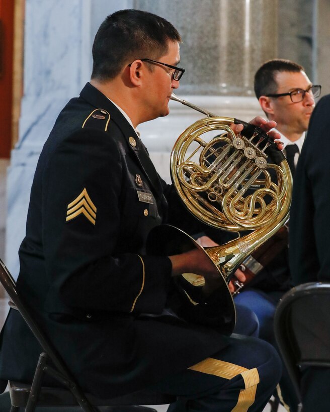 U.S. Army Sgt. Brandon Tagarook, a musician assigned to the Kentucky National Guard’s 202nd Army Band, plays the french horn at the Kentucky State Capitol rotunda in Frankfort, Kentucky, on June 10th, 2023. The 202nd performed to support the celebration of the 75th anniversary of the Women’s Armed Services Act. (U.S. Army photo by Spc. Danielle Sturgill)