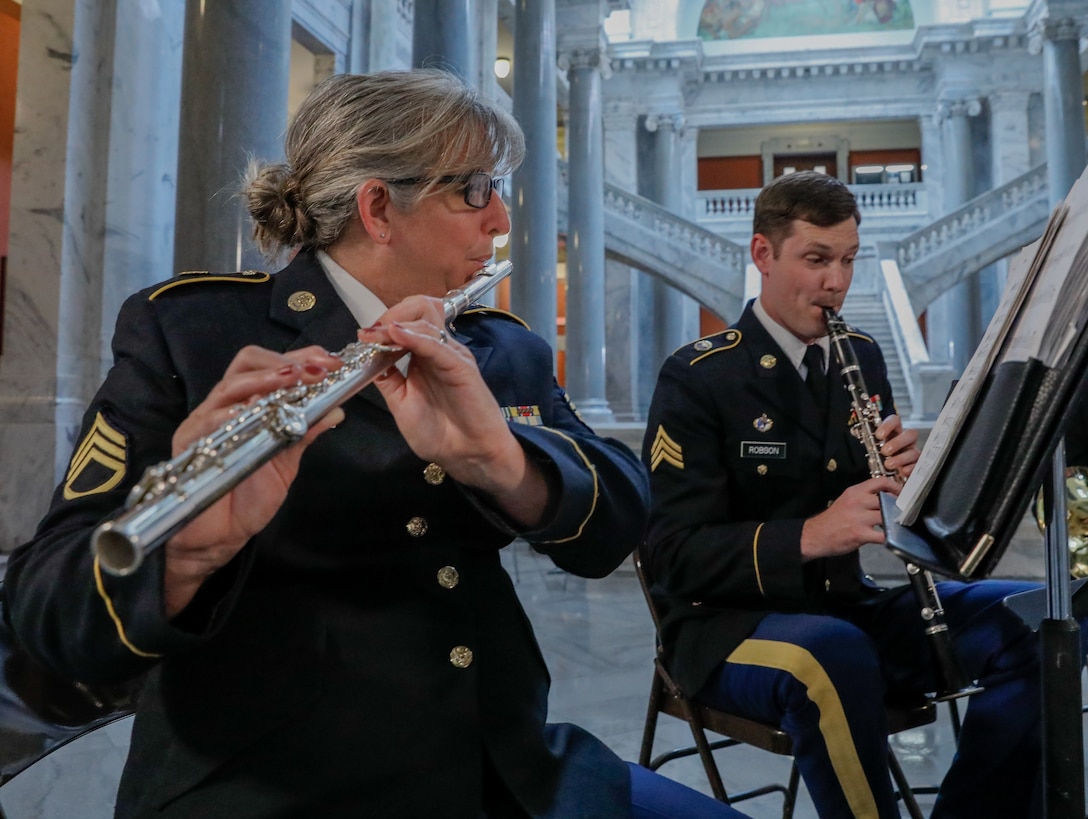 U.S. Army Staff Sgt. Kami Corcoran and Sgt. Jordan Robson, musicians assigned to the Kentucky National Guard’s 202nd Army Band, play instruments at the Kentucky State Capitol rotunda in Frankfort, Kentucky, on June 10th, 2023. Corcoran and Robson played their instruments in order to support the celebration of 75th anniversary of the Women's Armed Forces Intergration Act. (U.S. Army photo by Spc. Danielle Sturgill)
