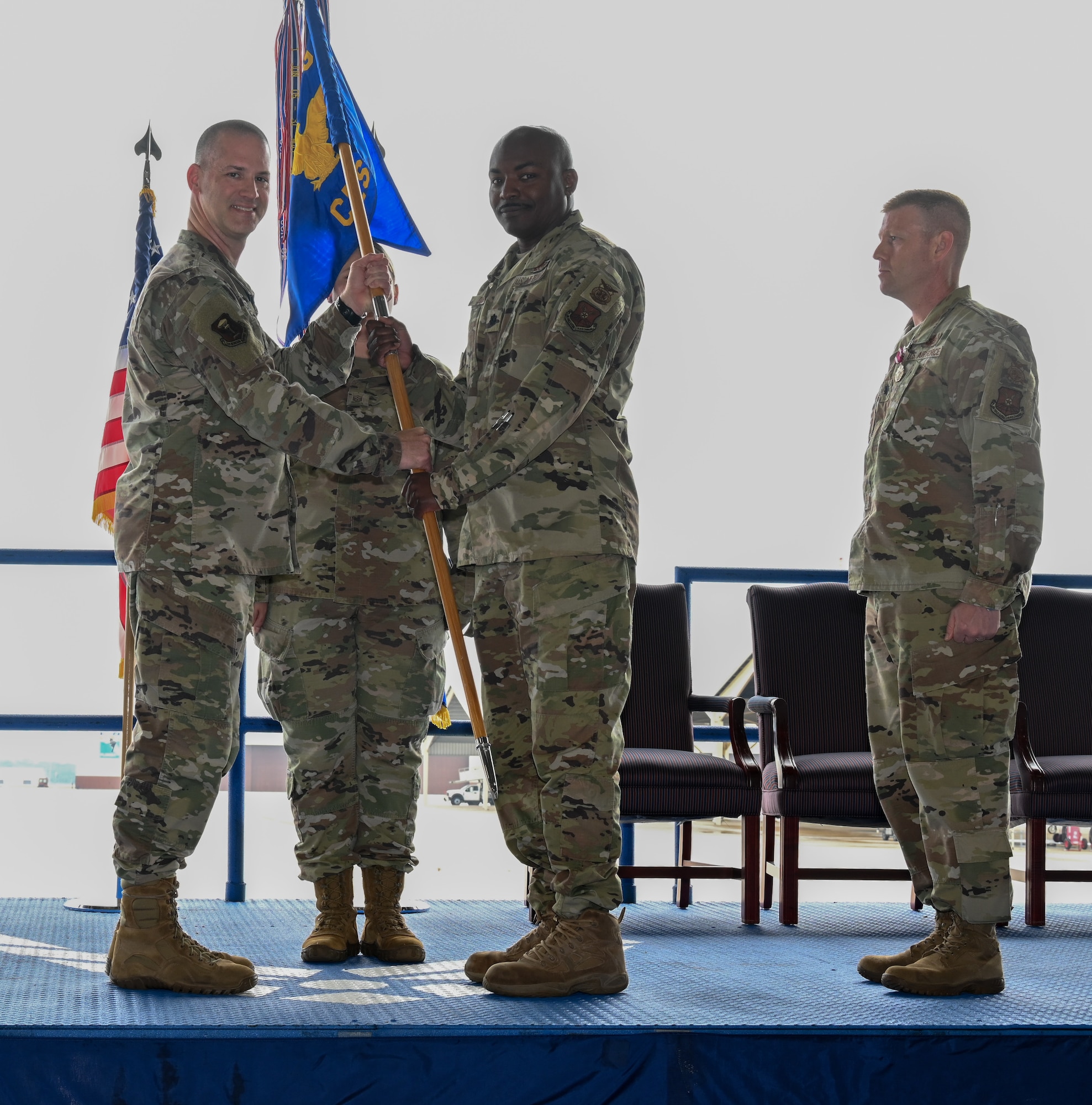 U.S. Air Force Lt. Col. Khary Davis, 509th Civil Engineer Squadron receives the squadron guidon from U.S. Air Force Lt. Col. Christopher Shlak, 509th Mission Support Squadron commander, assuming command during the 509th CES change of command ceremony at Whiteman Air Force Base, Missouri, June 8, 2023. The passing of the guidon symbolizes the passing of command from one commander to the next. (U.S. Air Force photo by Airman 1st Class Hailey Farrell)