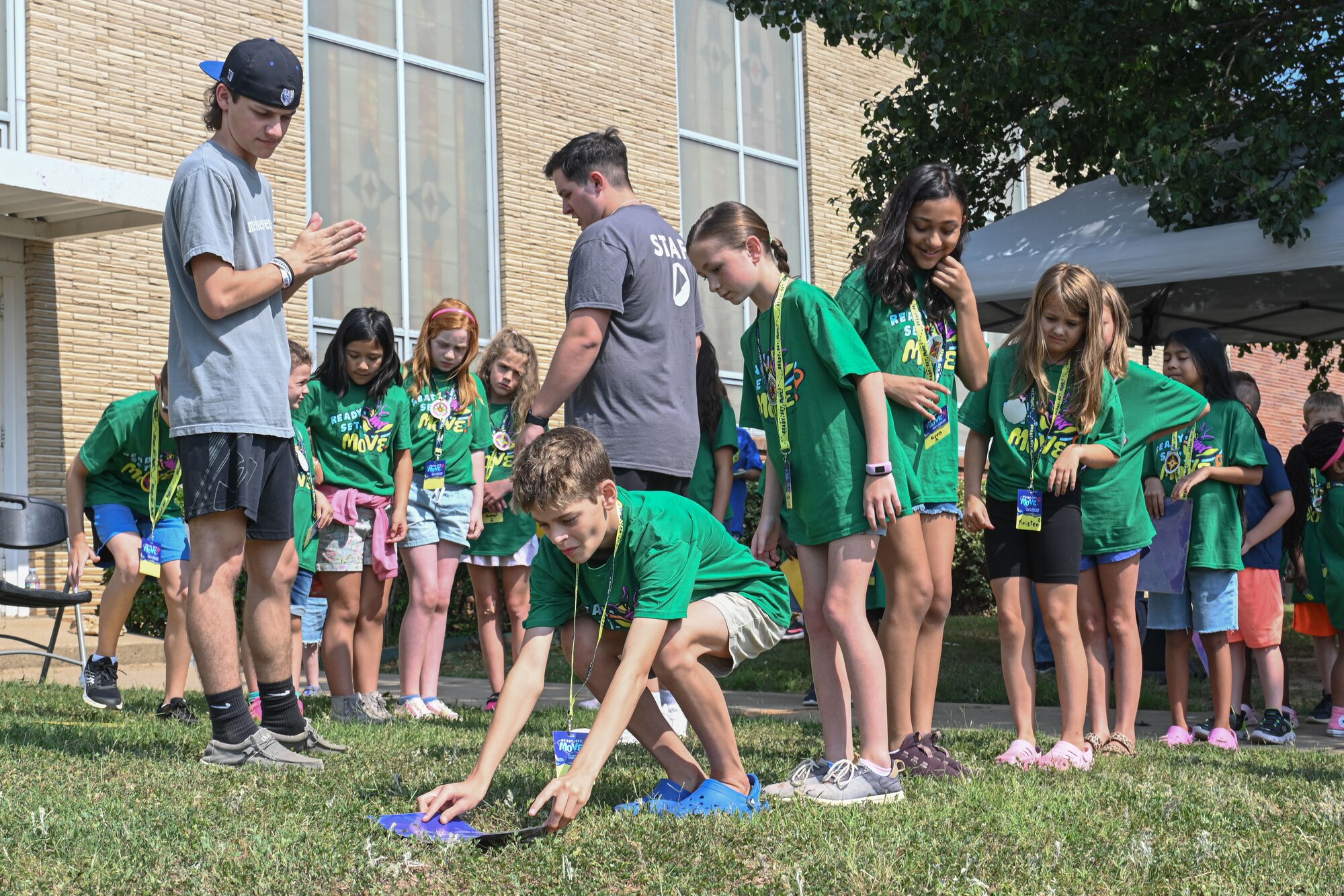 children participate in an outdoor game