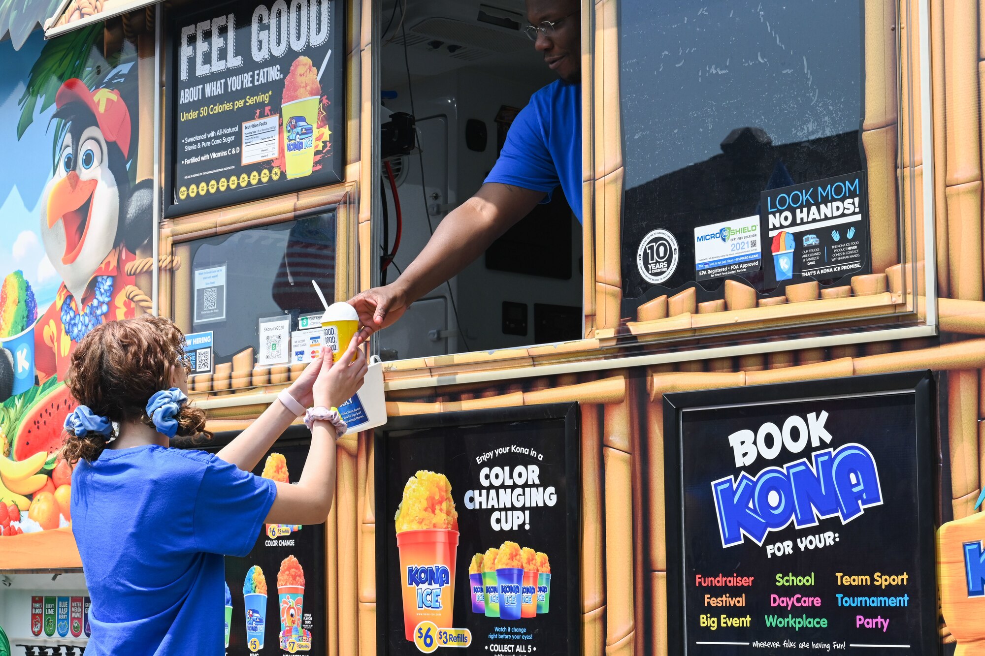 a child is given a snow cone