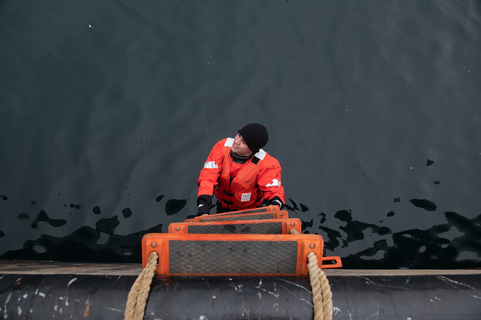 U.S. Coast Guard Cutter Sycamore (WLB 209) crew members conduct a dry suit test in preparation for Exercise Argus, Nuuk, Greenland, Jun 12, 2023. Exercise Argus is a joint search and rescue and marine environmental response exercise that includes assets from the United States, Denmark, Greenland, and France. (U.S. Coast Guard photo by Petty Officer 2nd Class Ryan Schultz)