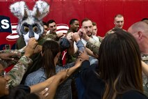U.S. Air Force Airmen and the Las Vegas Aces leadership get together for a group huddle in the Warrior Fitness Center, at Nellis Air Force Base, Nevada, June 9, 3023.