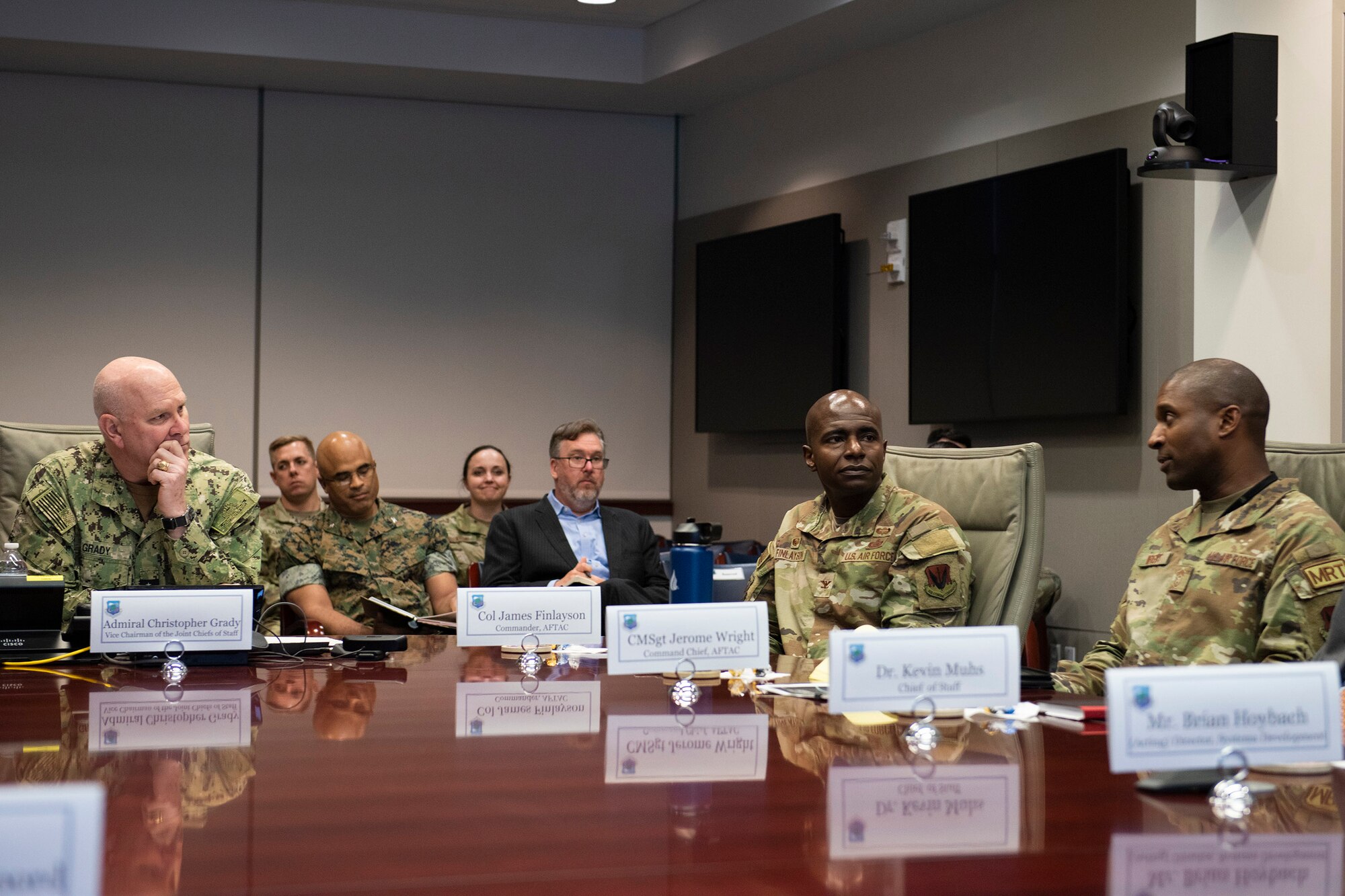 Chief Master Sgt. Jerome Wright (far right), Command Chief for the Air Force Technical Applications Center, briefs the Vice Chairman of the Joint Chiefs of Staff, Admiral Christopher W. Grady (left) June 9, 2023, during the admiral’s visit to the Department of Defense’s sole nuclear treaty monitoring center headquartered at Patrick Space Force Base, Fla.  Also pictured is Col. James A. Finlayson, AFTAC commander.  Grady said during his visit, “You do this mission, and you do it well. I have a great appreciation for the passion that exists here, and I’ve been impressed throughout my time here.”  (U.S. Air Force photo by Matthew S. Jurgens)