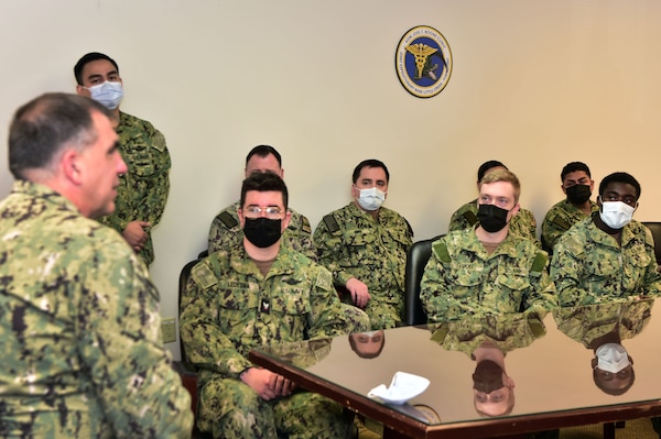 Atlantic (NMFL) and director, Tidewater Market, discuss challenges with Sailors and civilians during an all hands call at the Adm. Joel T. Boone Branch Health Clinic onboard Joint Expeditionary Base Little Creek-Fort Story.