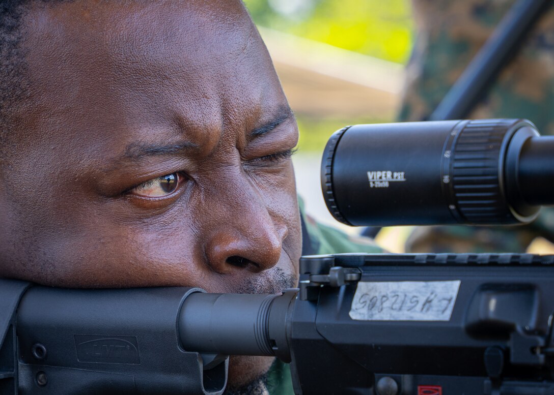 A Fuerzas Comando competitor sights-in his scope at the range, June, 12, 2023 in Sierra Prieta, Santo Domingo.