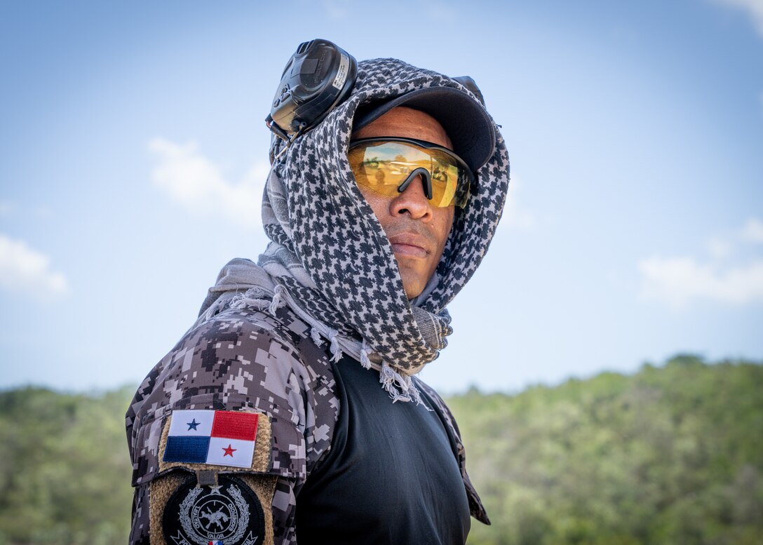 A Fuerzas Comando competitor from the 7th Special Forces Group uses a range finder at the range, June, 12, 2023 in Sierra Prieta, Santo Domingo.