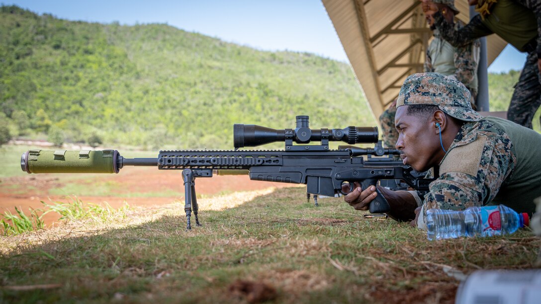 A Fuerzas Comando competitor sights-in his scope at the range, June, 12, 2023 in Sierra Prieta, Santo Domingo.