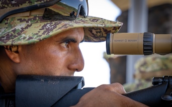 A Fuerzas Comando competitor sights-in his scope at the range, June, 12, 2023 in Sierra Prieta, Santo Domingo.